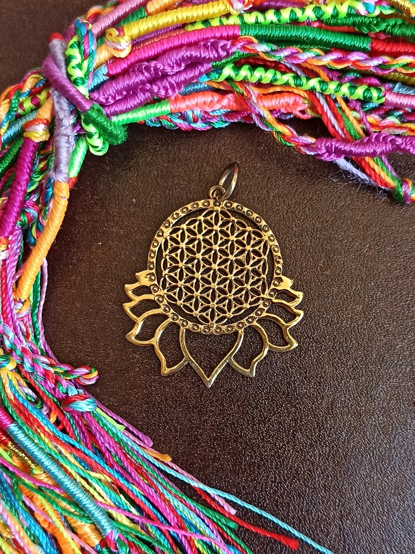 Golden necklace with flower of life and lotus flower pendant