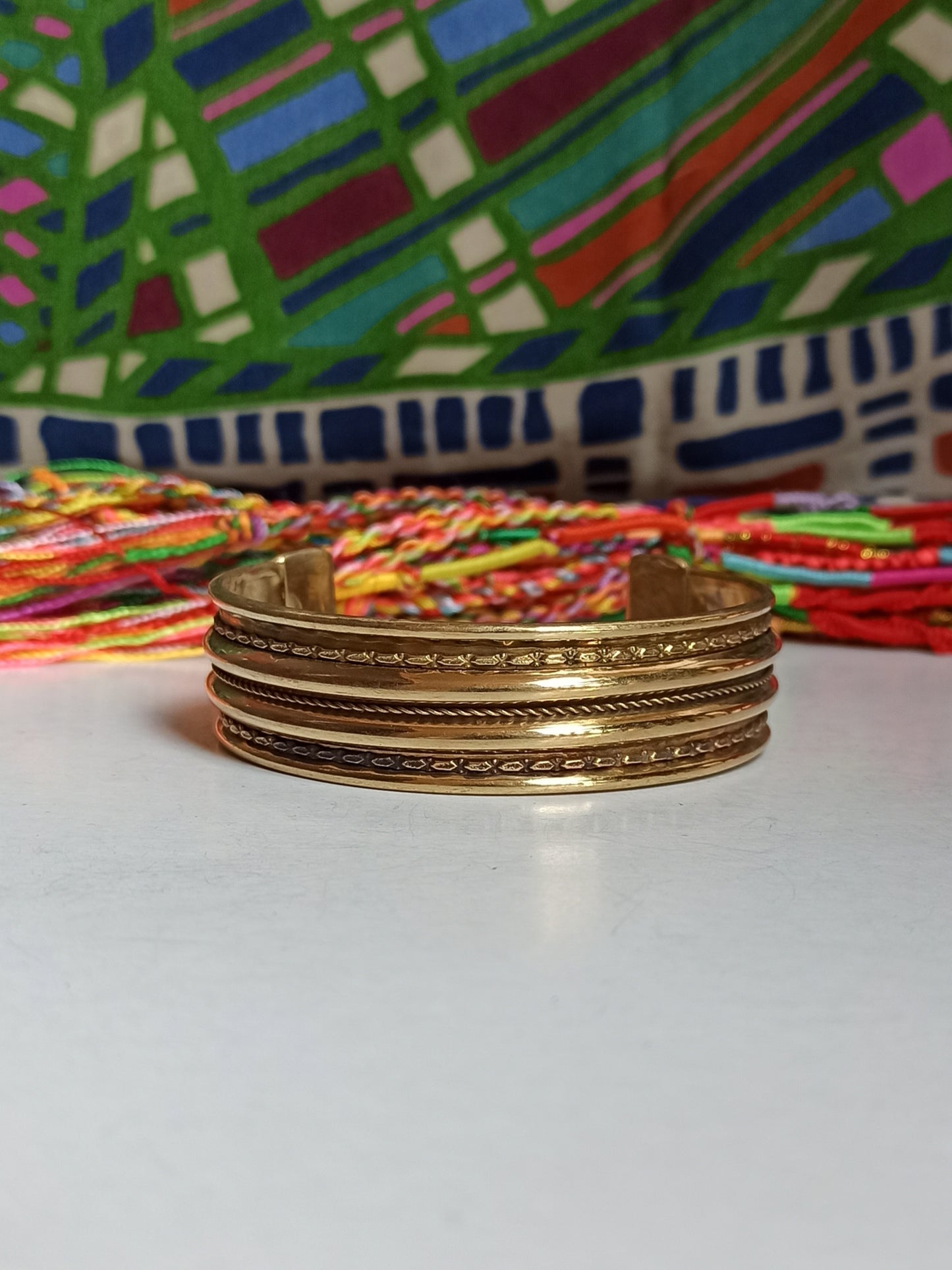 Thin golden bangle bracelet with 3 rows