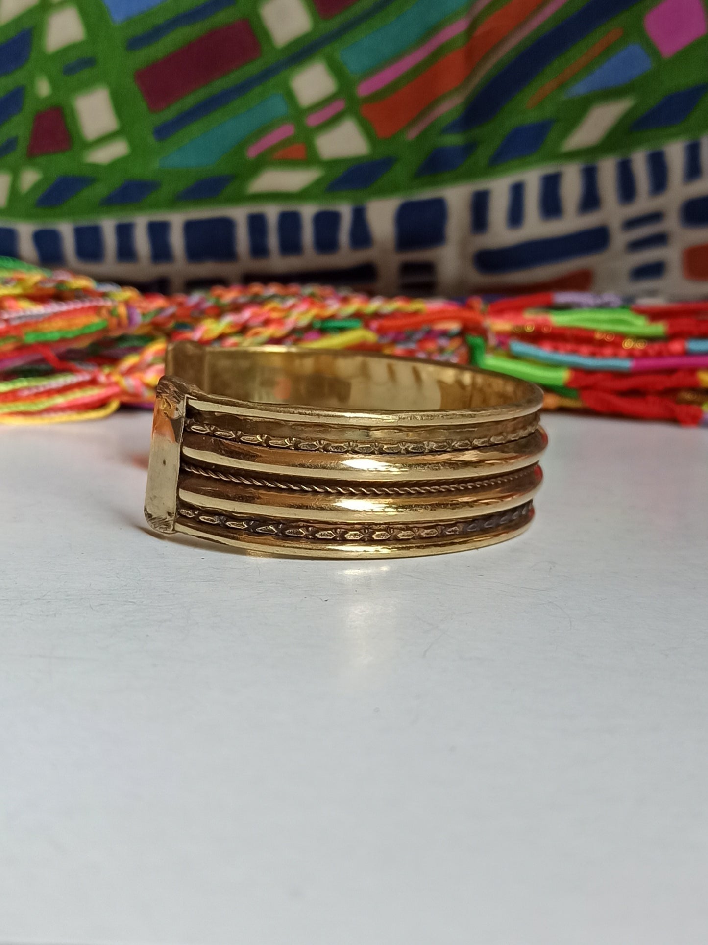 Thin golden bangle bracelet with 3 rows