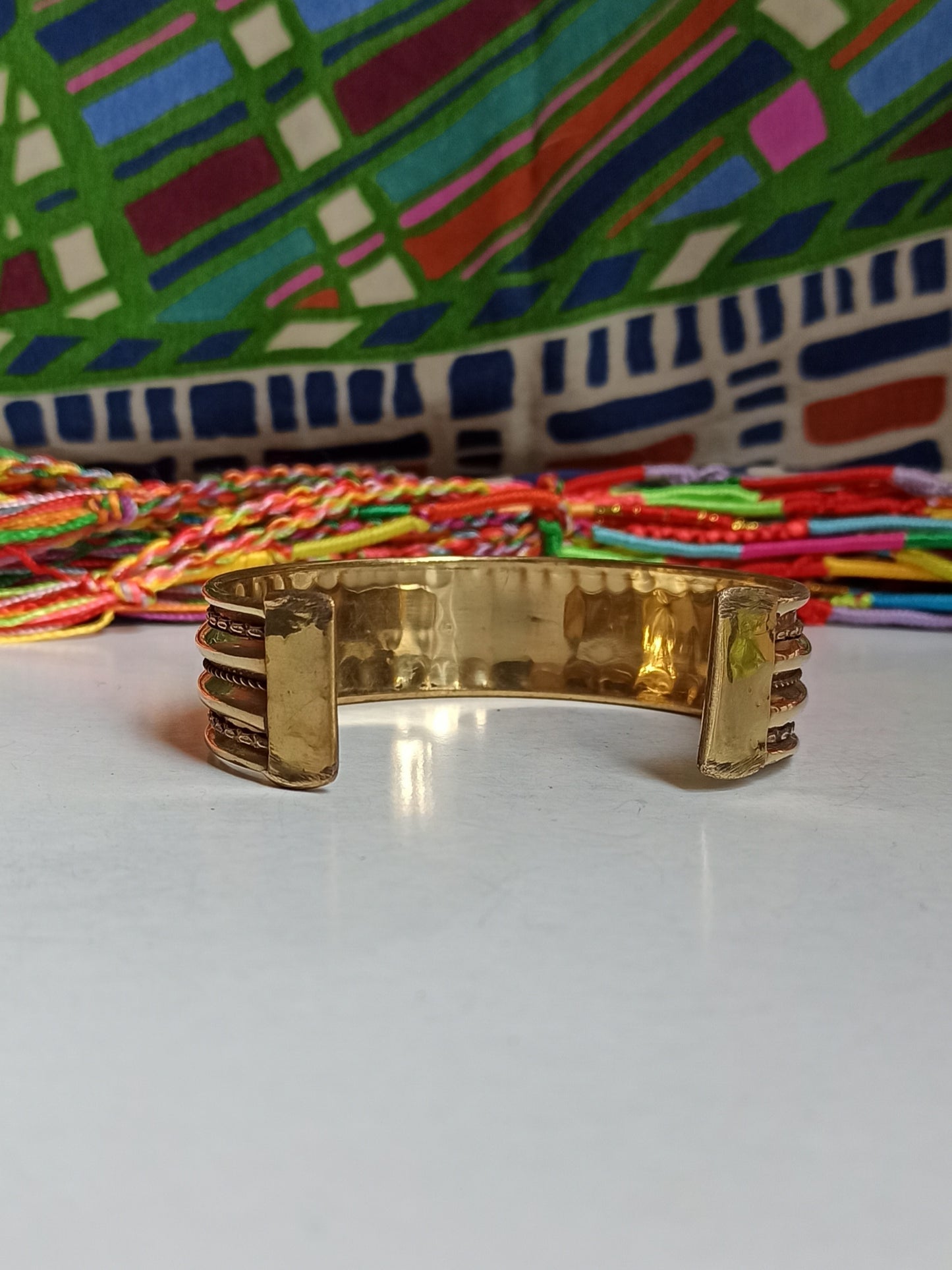 Thin golden bangle bracelet with 3 rows