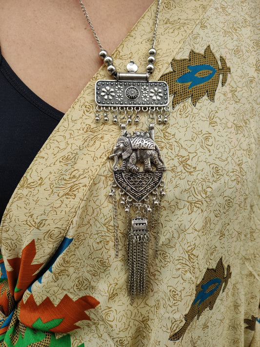 Necklace set and earrings long pendant metal medallion silver peacock India