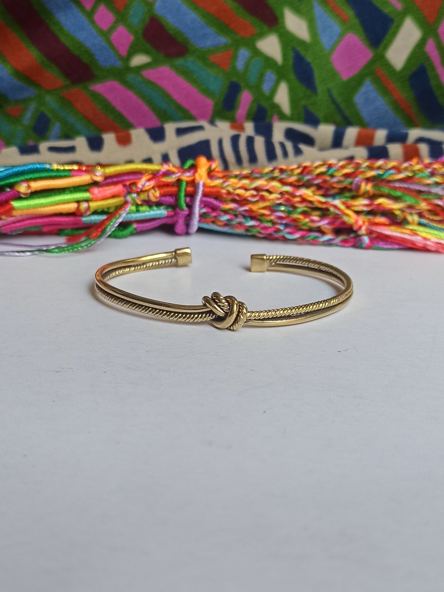 Thin golden knot bangle bracelet