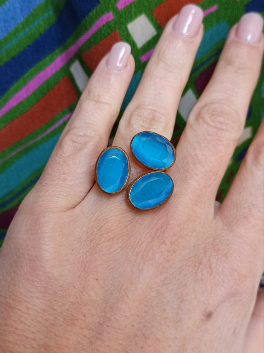 Golden ring with 3 turquoise stones