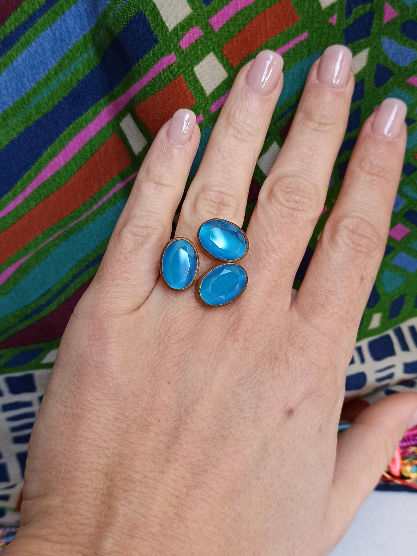 Golden ring with 3 turquoise stones