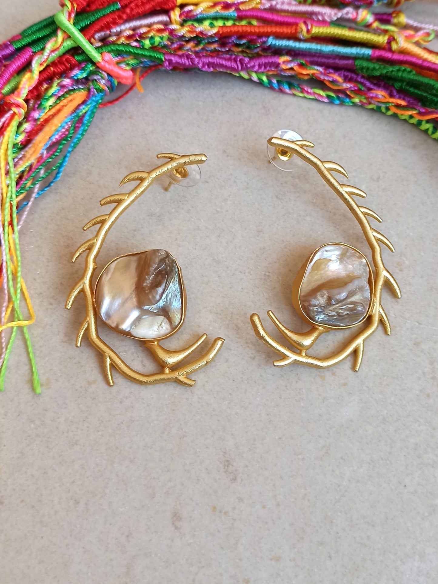 Stylized mother of pearl golden earrings