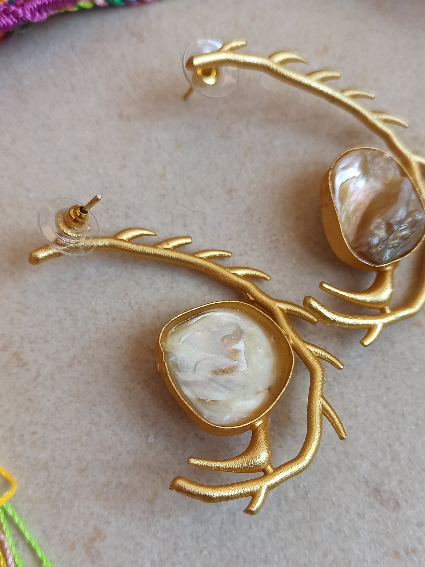 Stylized mother of pearl golden earrings