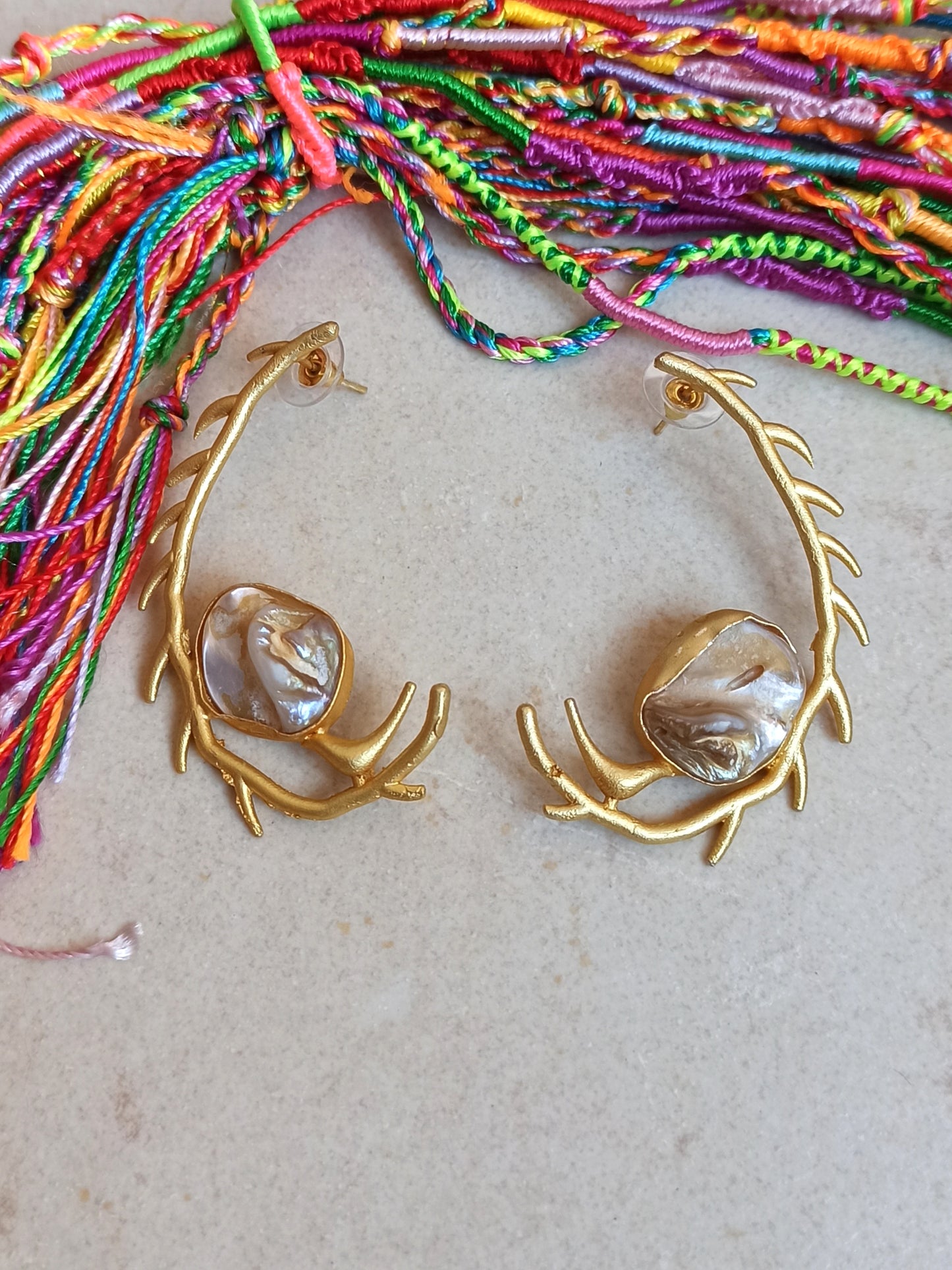 Stylized mother of pearl golden earrings