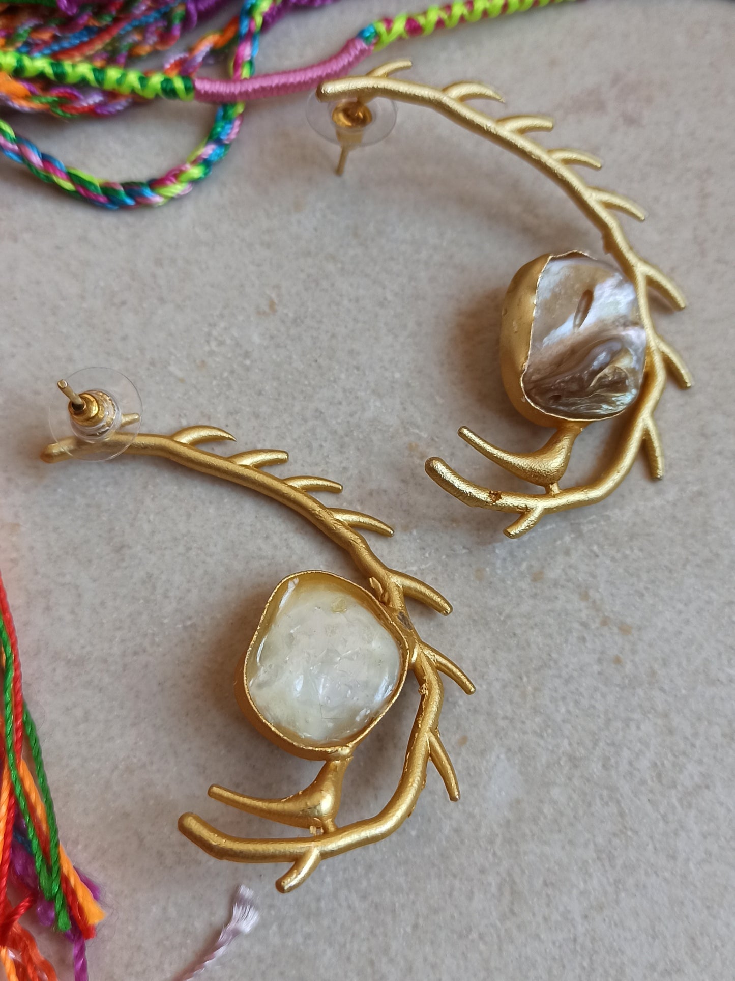 Stylized mother of pearl golden earrings