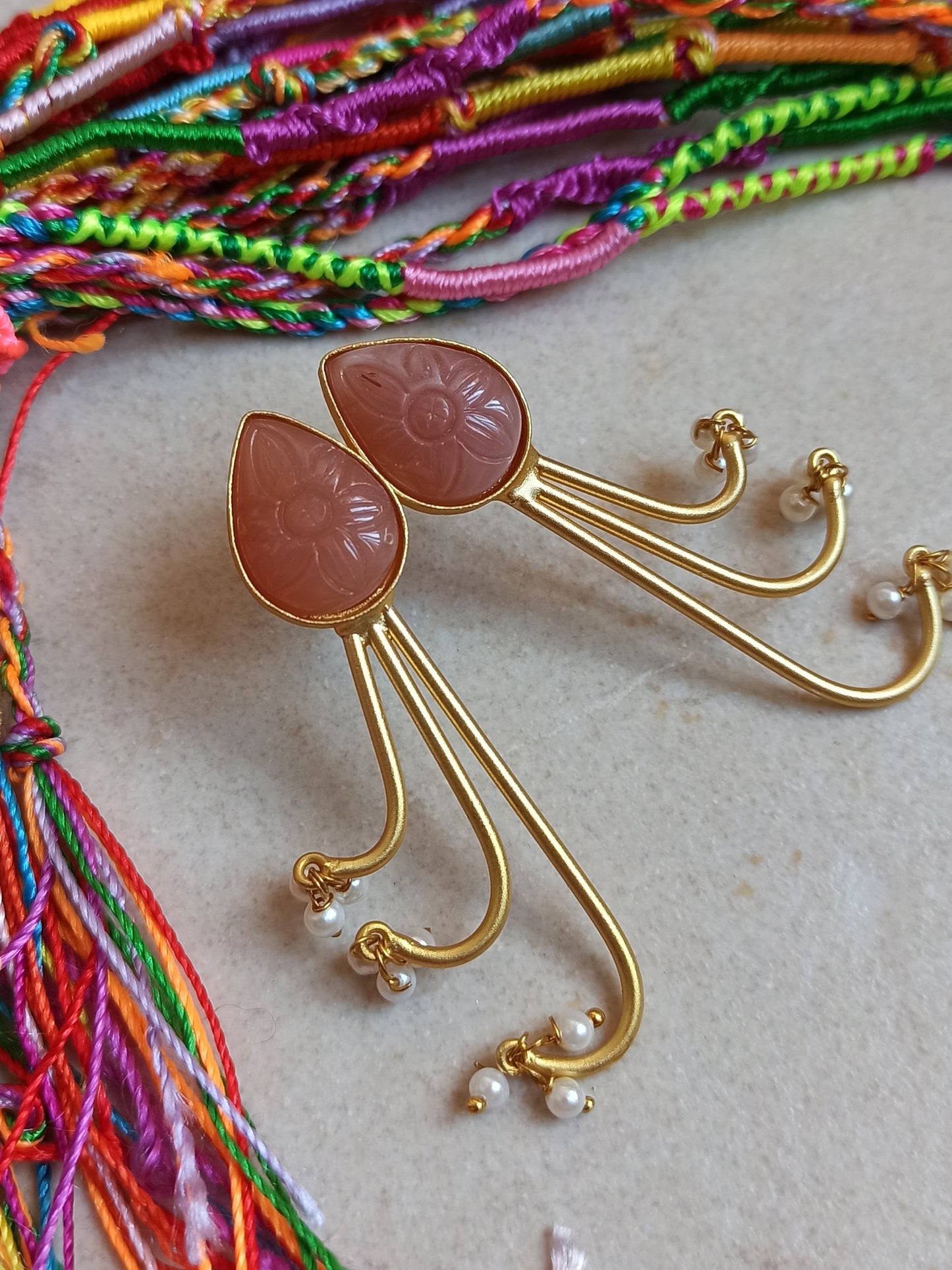 Pink dangling golden earrings