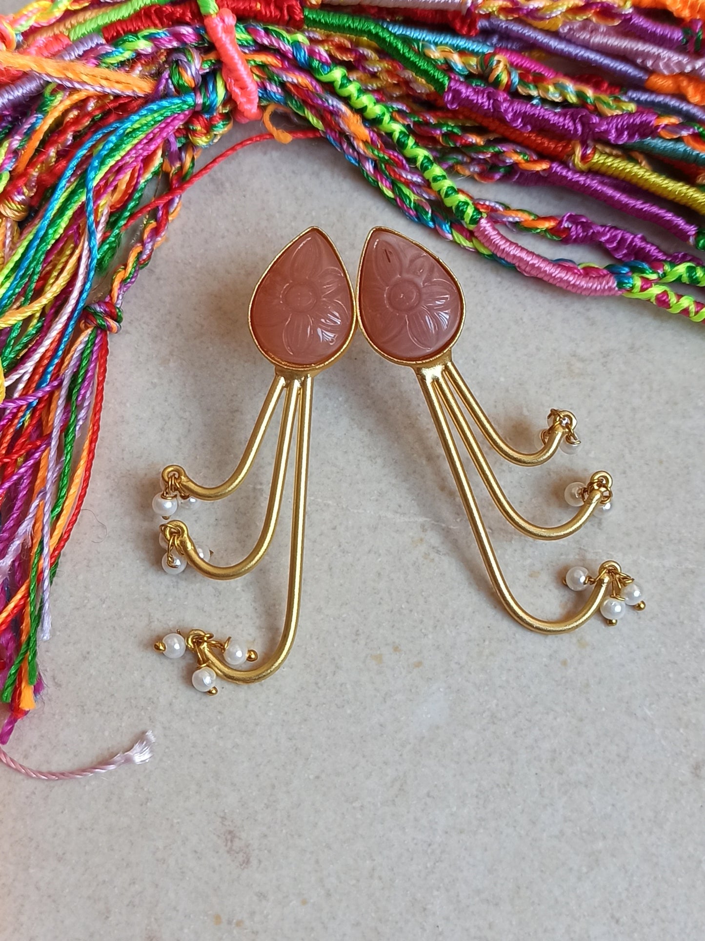 Pink dangling golden earrings