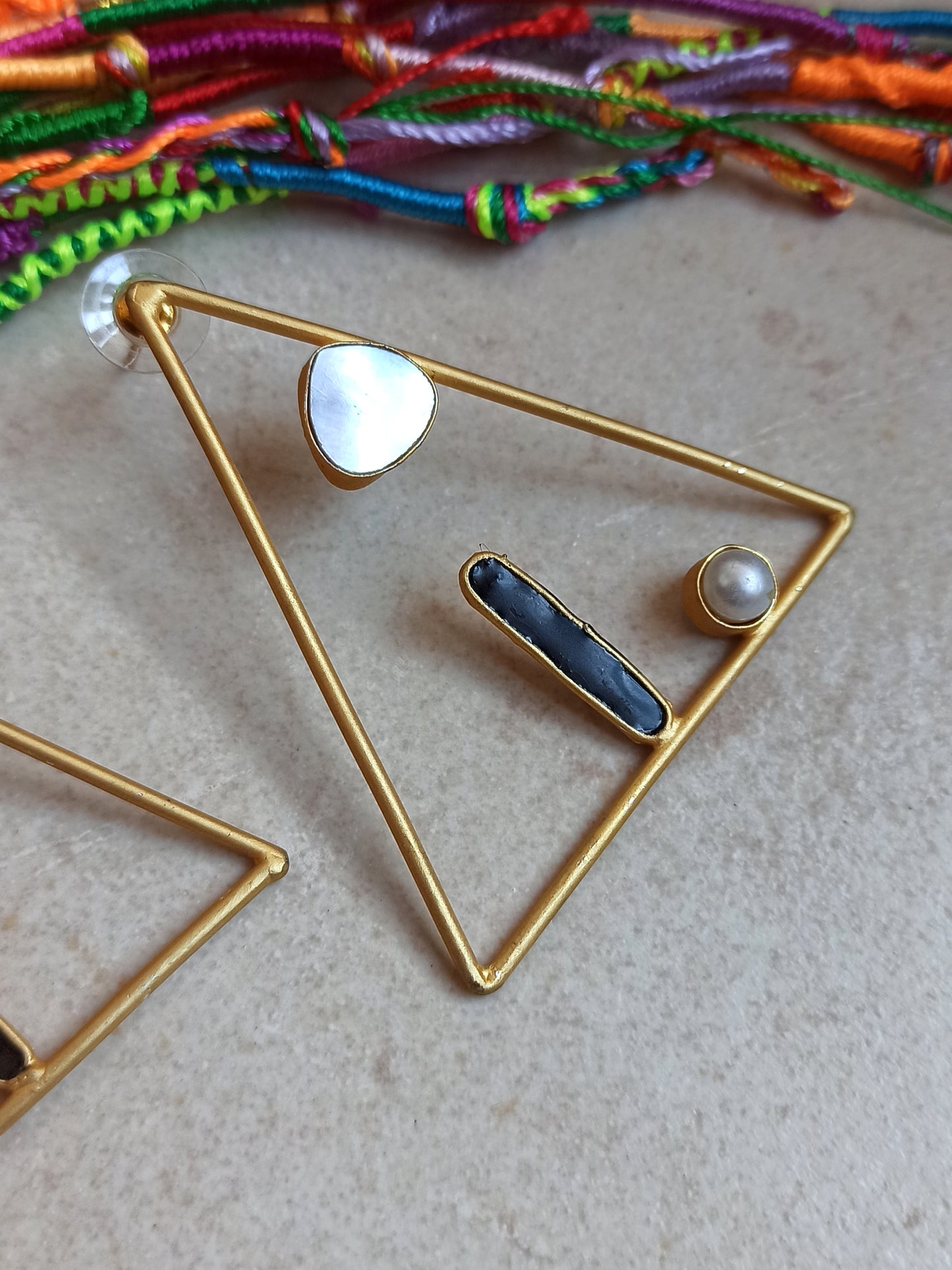 Golden mother-of-pearl and black triangle earrings