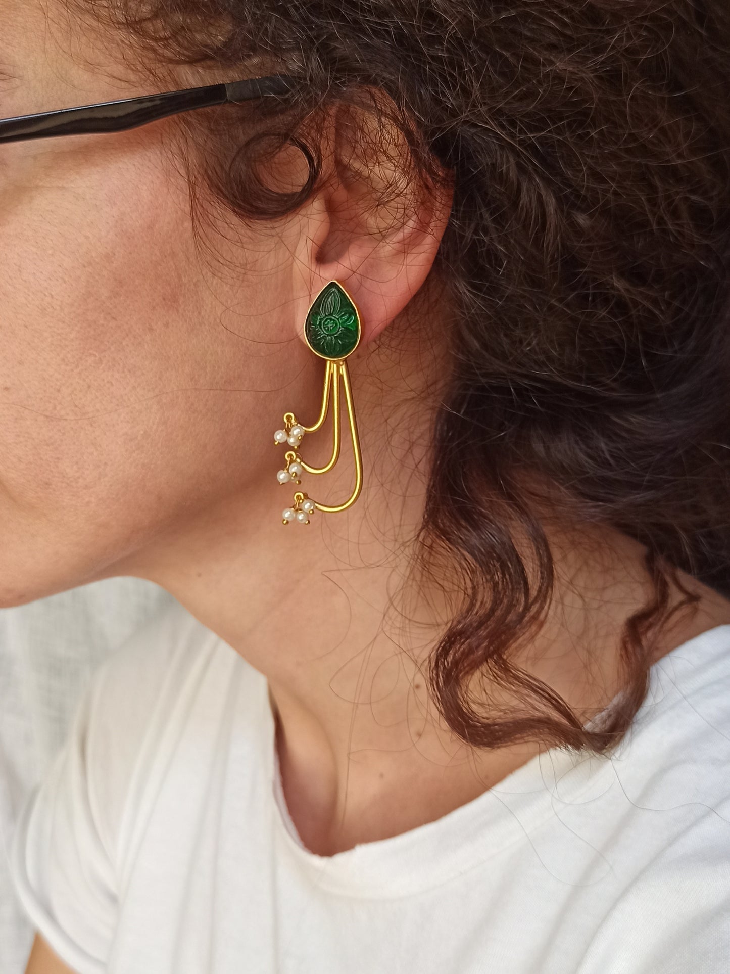 Green dangling golden earrings