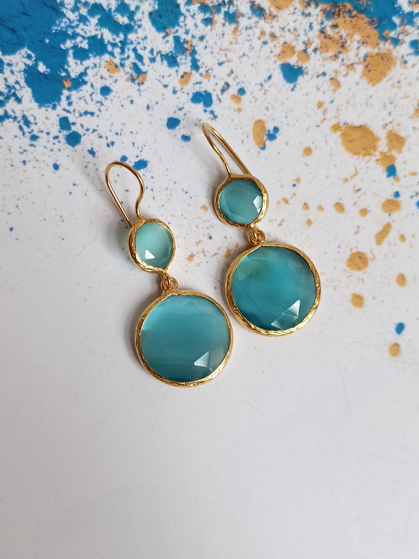 2 light blue stone earrings